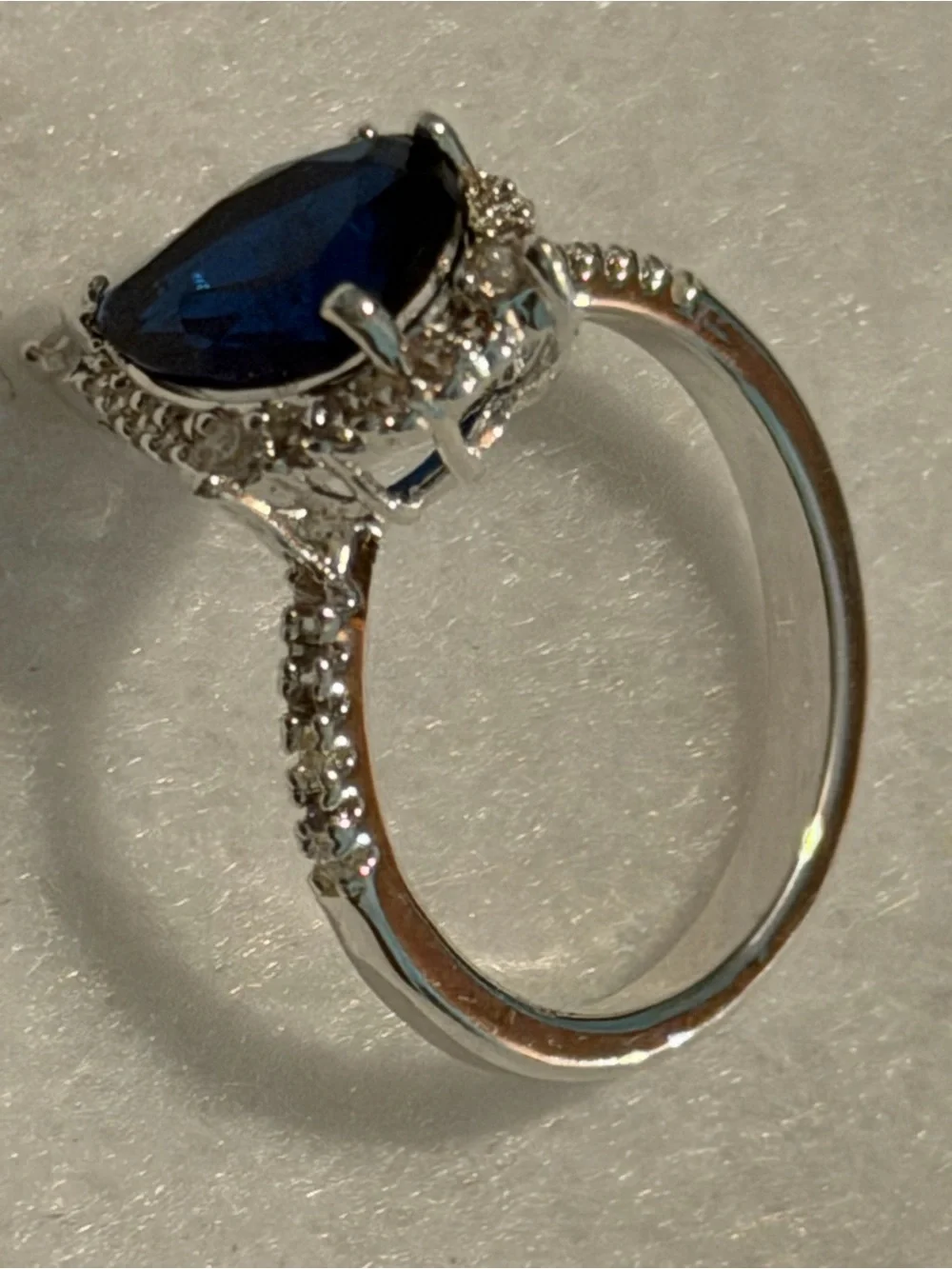 Silver Ring with Deep Blue Teardrop Stone and Pavé Accents